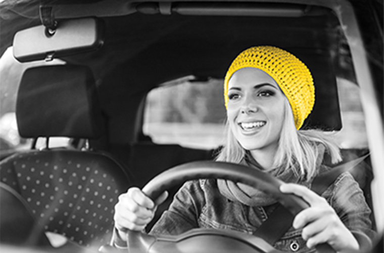 woman driving hertz rental car
