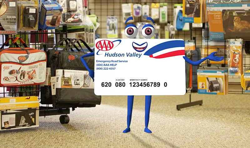 AAA card character standing in AAA travel store
