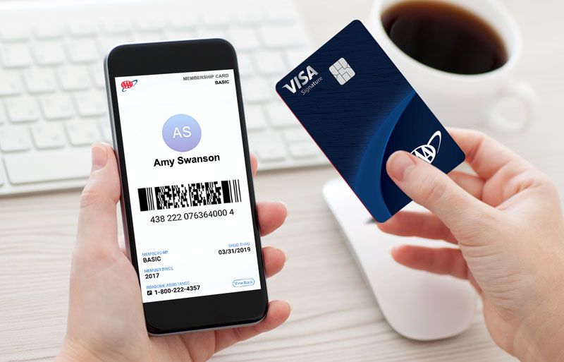 woman viewing her aaa app account while holding aaa credit card