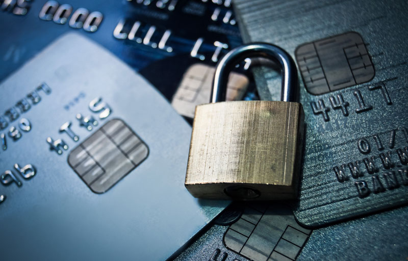 lock on top of pile of credit cards