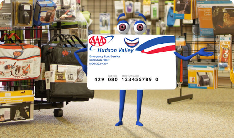 AAA card character standing in AAA Travel Store
