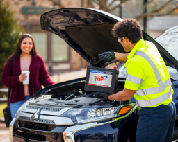 AAA Technician replacing a member's car battery