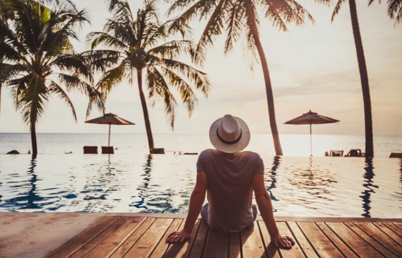 man on dock on tropical island