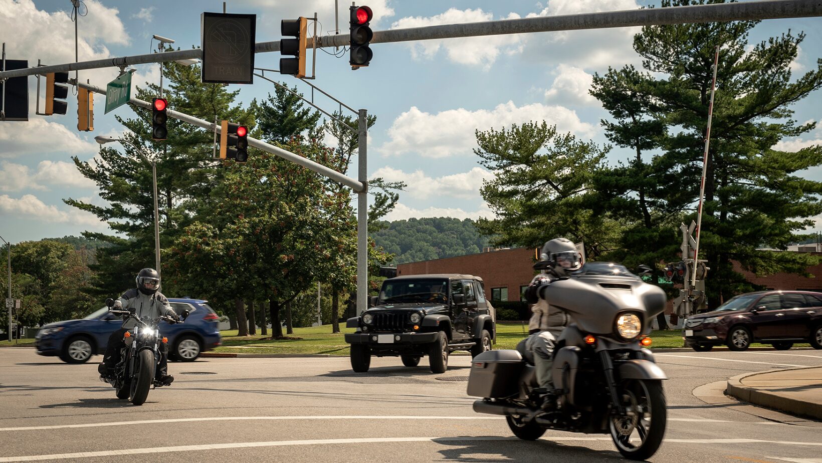 motorcycles making turn in traffic