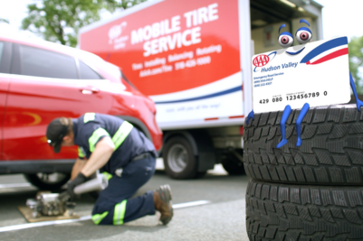 mobile tire tech changing tire