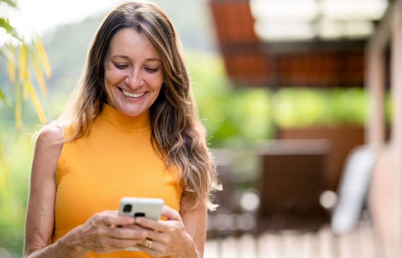 woman looking at cell phone