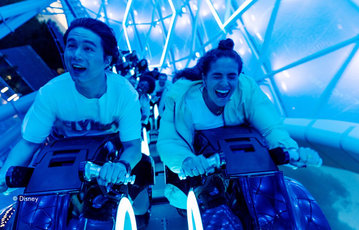Two Guests Riding Tron Coaster at Disney World